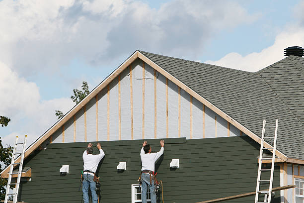 Professional Vinyl Siding technician working in Medford, MA